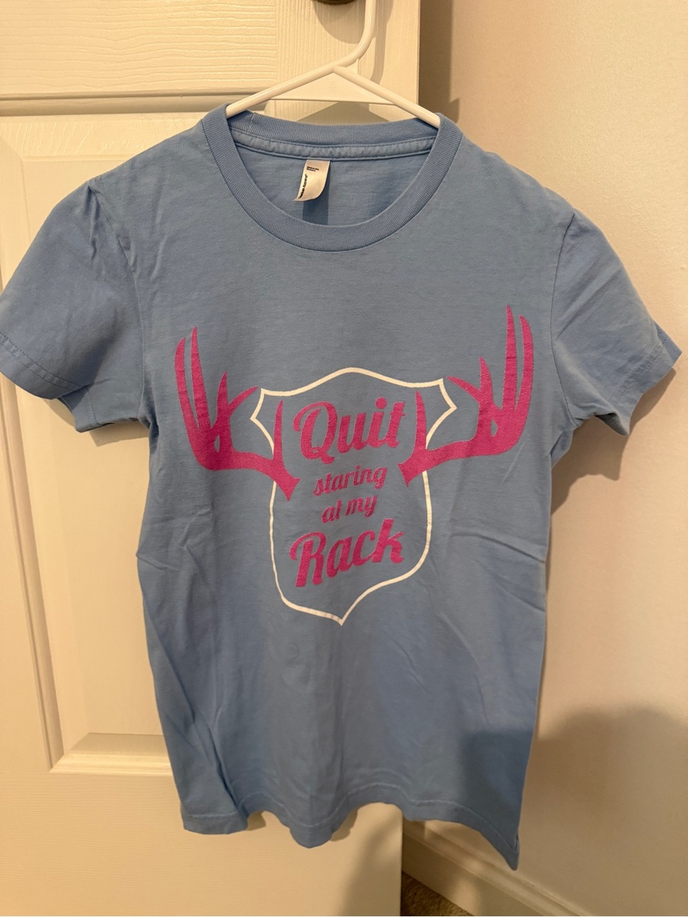 ‘quit staring at my rack’ Light Blue Graphic Tee with Pink Antler Design
